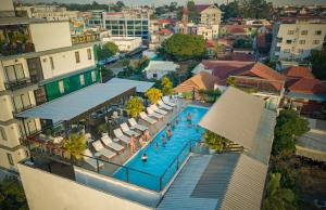 an overhead view of a swimming pool in a city at Onederz Siem Reap in Siem Reap