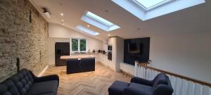 a kitchen and living room with skylights in a house at The Retreat in Eccleston