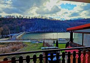 a view of a river from a balcony of a house at Rebeka Luxury Apartment in Tryavna