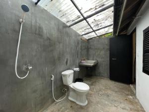 a bathroom with a toilet and a sink at Paradise Sunset Beach in Koh Rong Sanloem