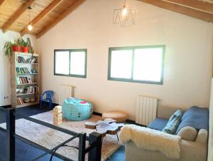 a living room with a couch and a table at Posada San Antonio in El Chalten