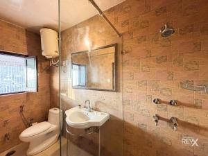 a bathroom with a sink and a toilet and a shower at Hotel Sunny Cot - Free Mall Shuttle and Parking in Mussoorie +63 photos