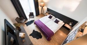 Postel nebo postele na pokoji v ubytování Hotel K99
