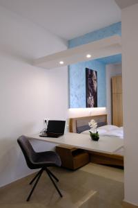 Ένα ή περισσότερα κρεβάτια σε δωμάτιο στο Blue House 2
