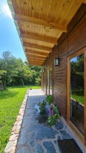 a porch of a house with a wooden roof at El Silencio, Lozano - Jujuy in Lozano +3 photos