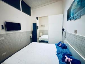 a bedroom with a bed with pink bows on it at Loft ANAGNINA in Rome