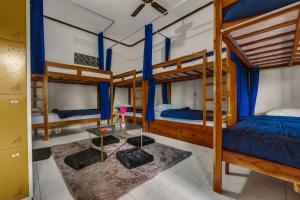 Postel nebo postele na pokoji v ubytování Ubud Backpacker Hostel