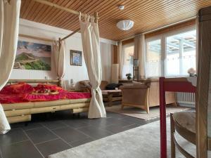 a bedroom with a large bed in a room at Berghof Arnika in Sankt Andreasberg
