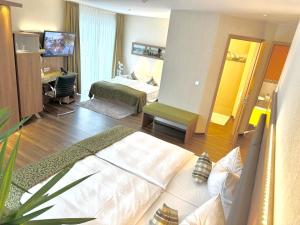 Postel nebo postele na pokoji v ubytování Hotel Simonshof