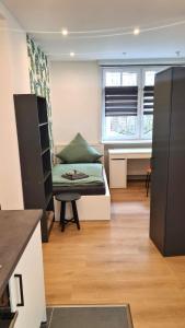 a living room with a couch and a table at Wohnung Ilz - im Zentrum, Parkplatz, Küche, getrennte Betten in Passau