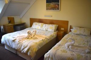 Ένα ή περισσότερα κρεβάτια σε δωμάτιο στο Harrington Guest House