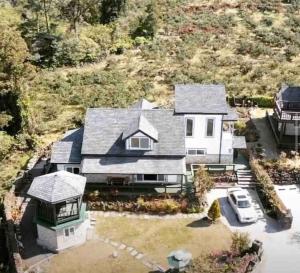 an aerial view of a house with a van in the driveway at Executive Home in Jeju in Jeju