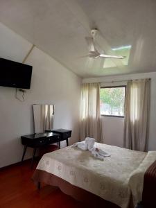 Postel nebo postele na pokoji v ubytování Tacuara Hotel