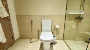 a bathroom with a toilet and a shower at 1BR Apartment in Yas Island with Private Balcony in Abu Dhabi