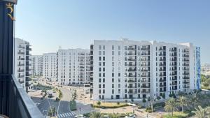 a view of a large white apartment building at 1BR Apartment in Yas Island with Private Balcony in Abu Dhabi