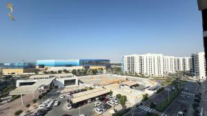 an aerial view of a parking lot in a city at 1BR Apartment in Yas Island with Private Balcony in Abu Dhabi