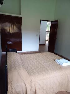 Postel nebo postele na pokoji v ubytování Tacuara Hotel