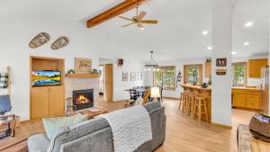 a living room with a couch and a fireplace at Rager Mountain - Unit 10 in Sunriver
