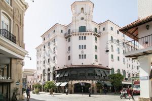 a large white building with a clock tower at Hotel Salta in Salta