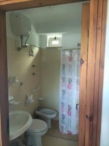 a bathroom with a toilet and a sink at Villa Calise in Forio d'Ischia