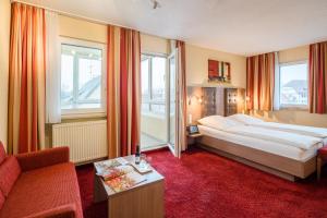 Postel nebo postele na pokoji v ubytování Hotel Zur Schmiede