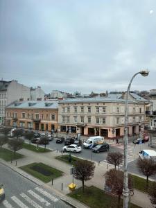a city with cars parked in a parking lot at Elite apart on Shevchenko Avenue in Lviv