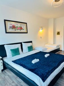 Postel nebo postele na pokoji v ubytování Kael Apartment