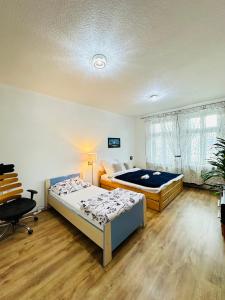 Postel nebo postele na pokoji v ubytování Kael Apartment