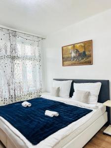 Postel nebo postele na pokoji v ubytování Kael Apartment