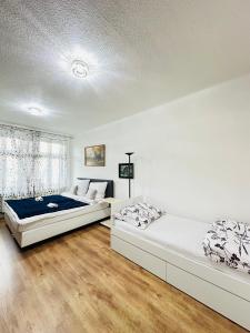 Postel nebo postele na pokoji v ubytování Kael Apartment