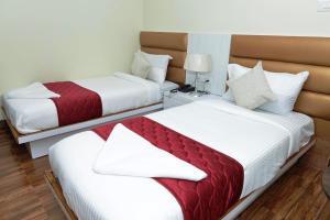 Ліжко або ліжка в номері Hotel Priority A Unit of Priority Hospitality