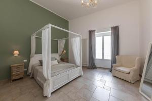 Posteľ alebo postele v izbe v ubytovaní Albergo Diffuso Monopoli