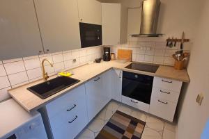 Køkken eller tekøkken på Bungalow am Berliner Stadtrand + 2 billeder