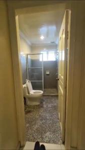 a bathroom with a toilet and a tub in a room at KUCHING StayAt Somerset Gateway 2 Room Apartment in Kuching