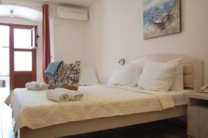 Postel nebo postele na pokoji v ubytování Hotel Sara