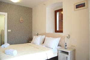 Postel nebo postele na pokoji v ubytování Hotel Sara