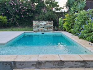 a swimming pool in a yard with a fire hydrant at La Soñada in La Paz