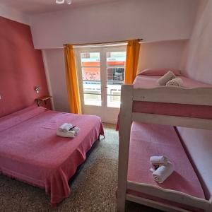 Ένα ή περισσότερα κρεβάτια σε δωμάτιο στο Hotel Nuevo Splendid en la Peatonal