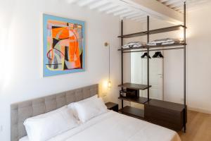a bedroom with a white bed and a bunk bed at Tenuta Asmara Luxury Resort in San Miniato +196 photos