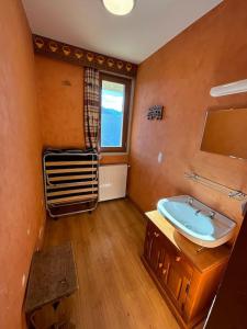a bathroom with a sink and a window at Chalet de l'Ours - Pla d'Adet in Cadeilhan-Trachère +31 photos