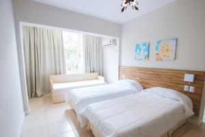 Postel nebo postele na pokoji v ubytování Hotel Sandrini