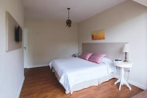 Postel nebo postele na pokoji v ubytování Hotel Sandrini