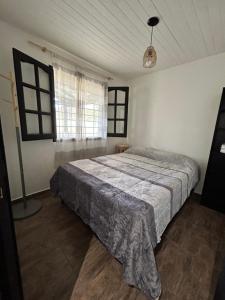 Ένα ή περισσότερα κρεβάτια σε δωμάτιο στο Cabañas los Ceibos +4 φωτογραφίες