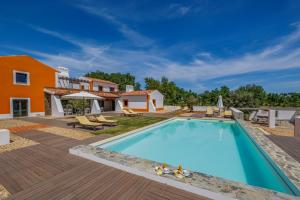 an image of a swimming pool in a villa at Tons da Terra - Casa de Campo & SPA in São Domingos