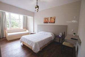 Postel nebo postele na pokoji v ubytování Hotel Sandrini