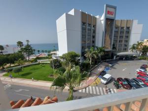 a view from a balcony of a hotel with a parking lot at SPACIOUS FLAT 100M FROM BEACH-NERJA-Spain in Nerja