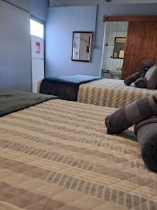 Postel nebo postele na pokoji v ubytování Rustic Farm Stay