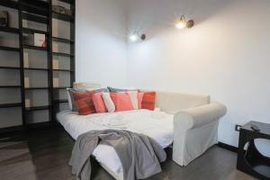 A bed or beds in a room at Appartamento a 100m dal mare e dal Gaslini