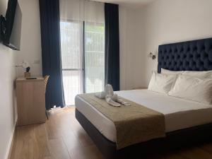 Postel nebo postele na pokoji v ubytování Hôtel Blue Sky