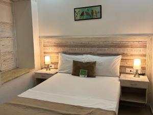 Postel nebo postele na pokoji v ubytování Hotel La Magdalena